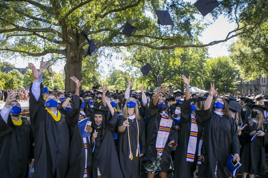Graduates toss their caps in celebration of their accomplishment