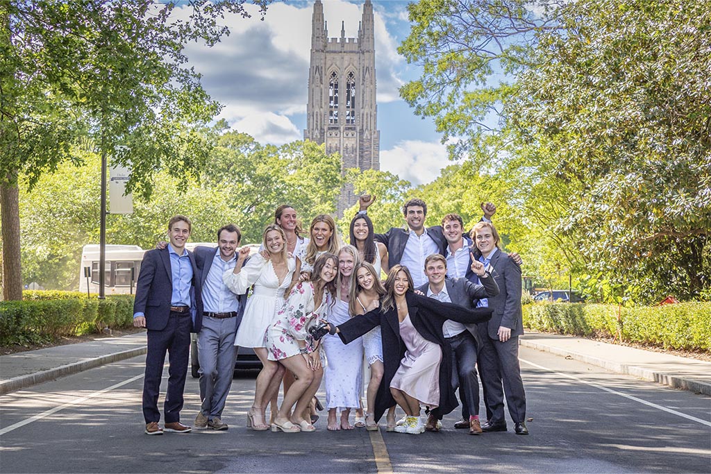 A group of graduates standing on Chapel Drive with Duke Chapel in the background