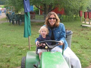 Woman and child on tractor